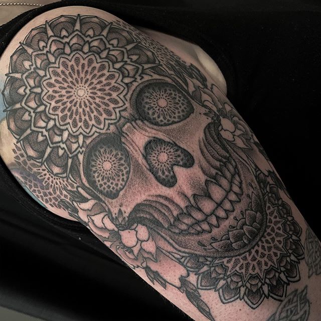 Tattoo of Skull with Mandalas on upper arm and shoulder done in black and grey by tattoo artist Alan Lott of Sacred Mandala Studio